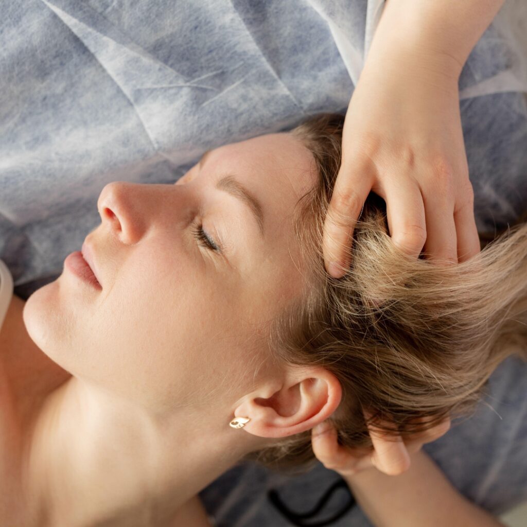 woman receiving cranial massage